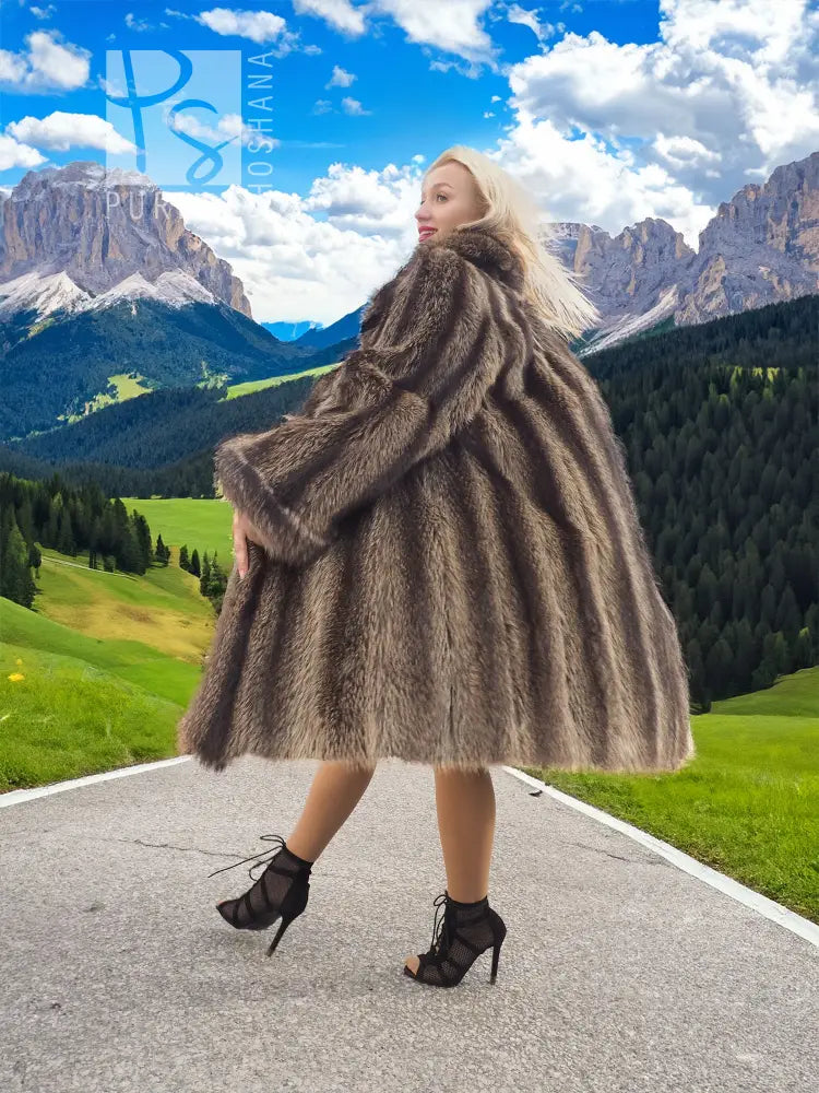 Raccoon fur coat with detachable hood, dark brown, side view showing full swing hem