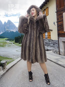 Dark brown fur coat with attached hood, long sleeves and flared hem with slit