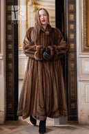 Brown full-length mink fur coat with large collar and sculpted cuff detail