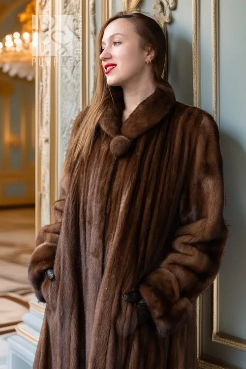 Demi buff mink fur coat with stand collar, button front, long sleeves.