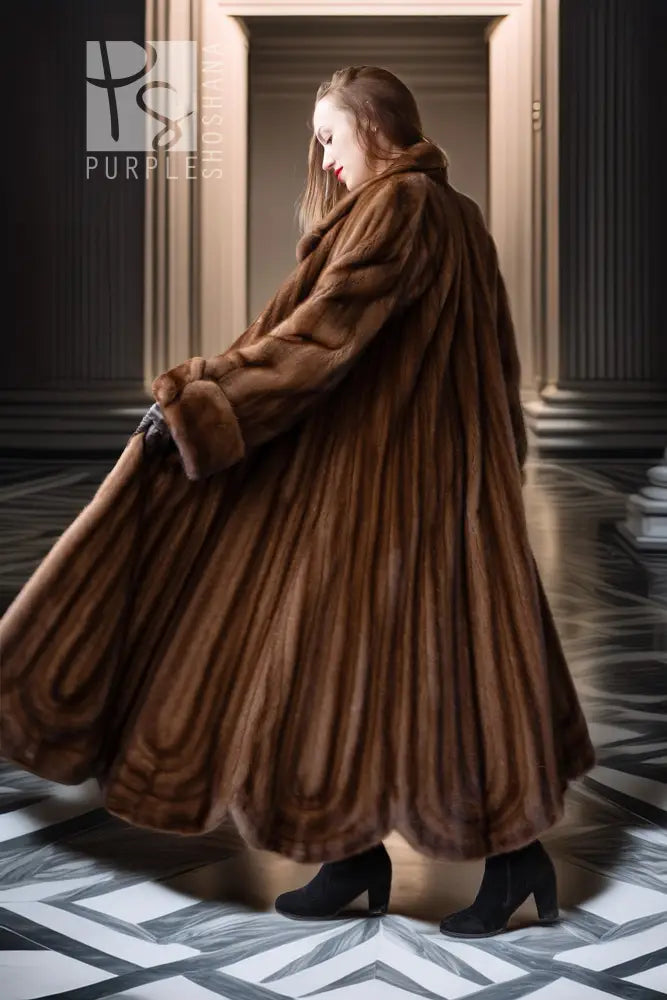 Brown mink fur full-length coat in side view, draped open front and wide shawl collar
