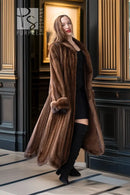 Brown mink fur coat with long sleeves and straight draped silhouette, side view