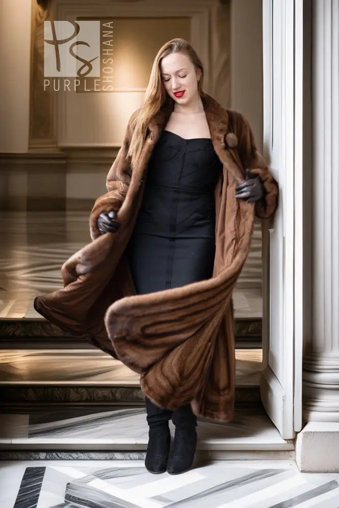 Brown mink fur coat with open front, wide shawl collar, and long draped sleeves