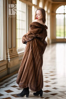 Brown mink fur coat with rounded collar and oversized draped sleeves, back view