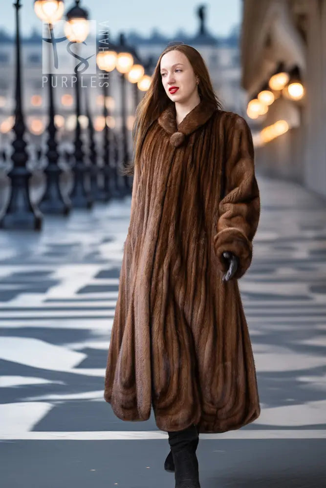 Brown mink fur coat with oversized collar and full-length silhouette
