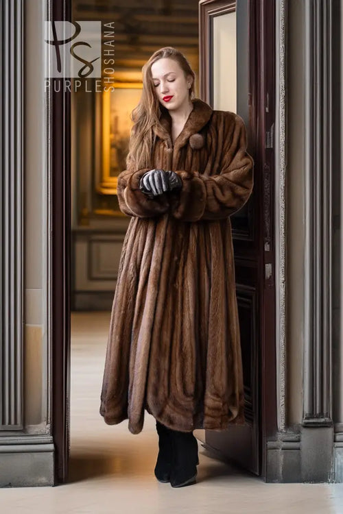 Brown full-length mink fur coat with structured collar and rounded sleeve cuffs