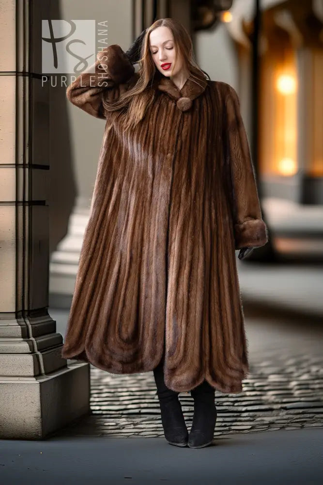 Brown mink fur coat with sculpted vertical panels and voluminous skirt
