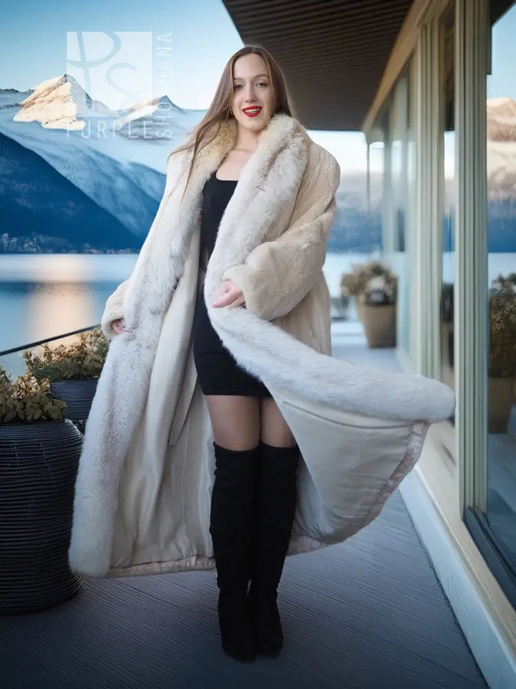 Cream champagne fur coat over black dress, front view with open front