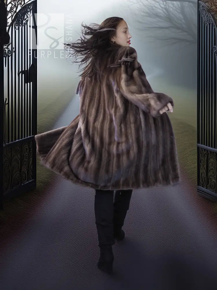 Mink fur demi coat with fringe trim at hem and flared silhouette, hooded style