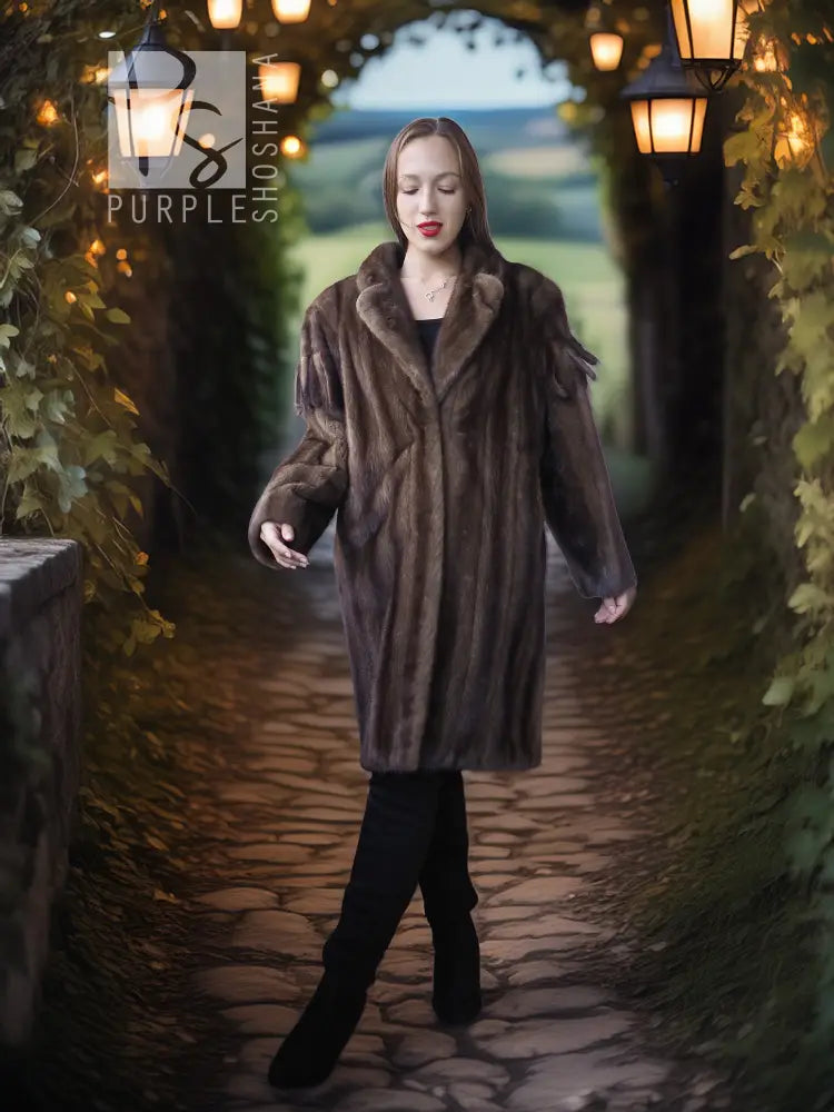 Mink fur demi coat with shaggy texture, notched collar, and fringe at cuffs