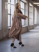 Brown mink fur coat with high stand collar, angled side view