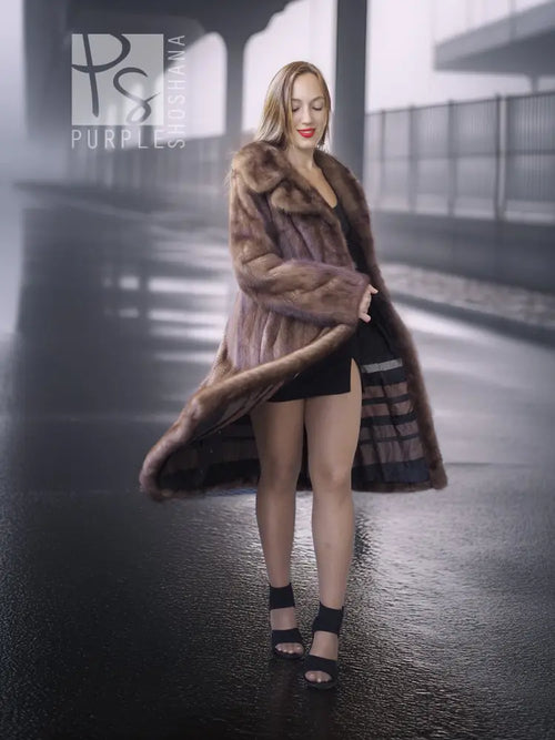 Brown mink fur coat with high stand collar and mid-length silhouette