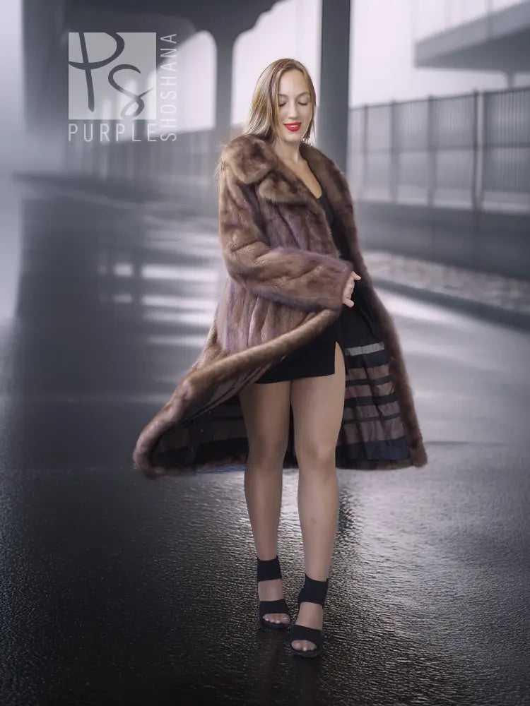 Brown mink fur coat with high stand collar and mid-length silhouette