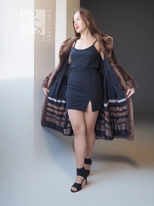 Mink fur stroller coat with high stand-up collar, striped hem, swing silhouette