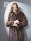 Mink fur coat close-up with stand collar and open front, brown, hands at waist