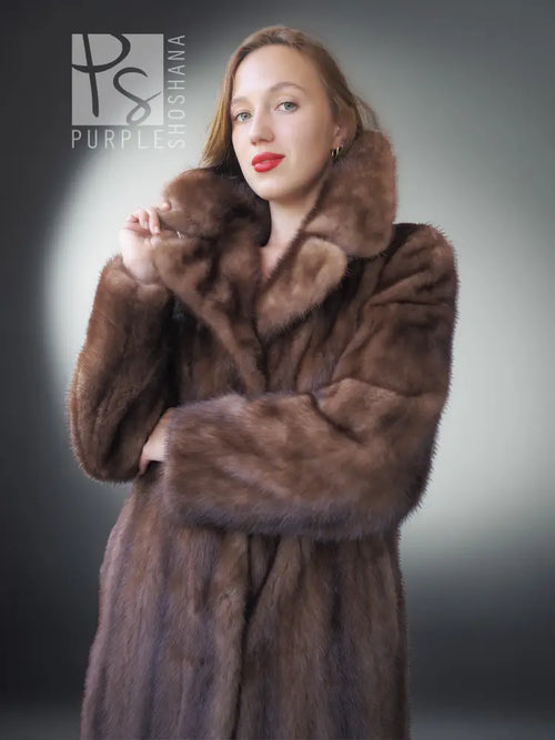 Brown mink fur coat close-up with high stand collar and textured fur pattern