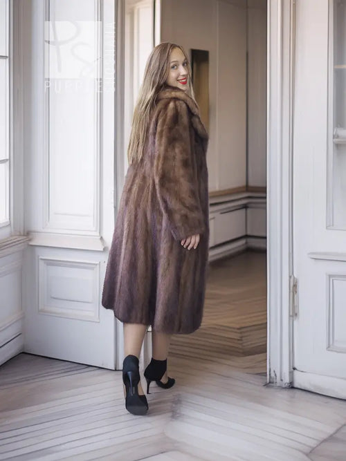 Brown mink fur coat with high stand collar, side view of hem