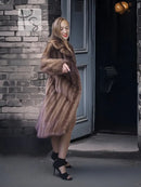 Brown mink fur coat with high stand collar, side view with flared hem