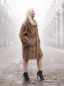 Pastel brown mink fur stroller jacket side profile with long sleeves and plush fur