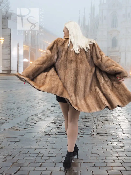 Brown mink fur coat with hood and button front, wide flared hem