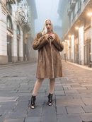 Brown hooded mink fur coat with button closure, mid-calf length