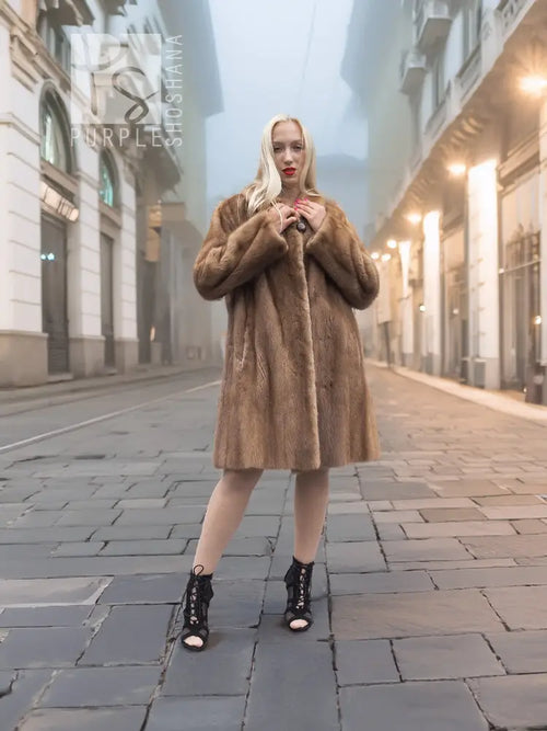 Brown hooded mink fur coat with button closure, mid-calf length