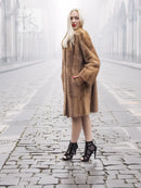 Pastel brown mink fur stroller jacket front view with straight, relaxed fit