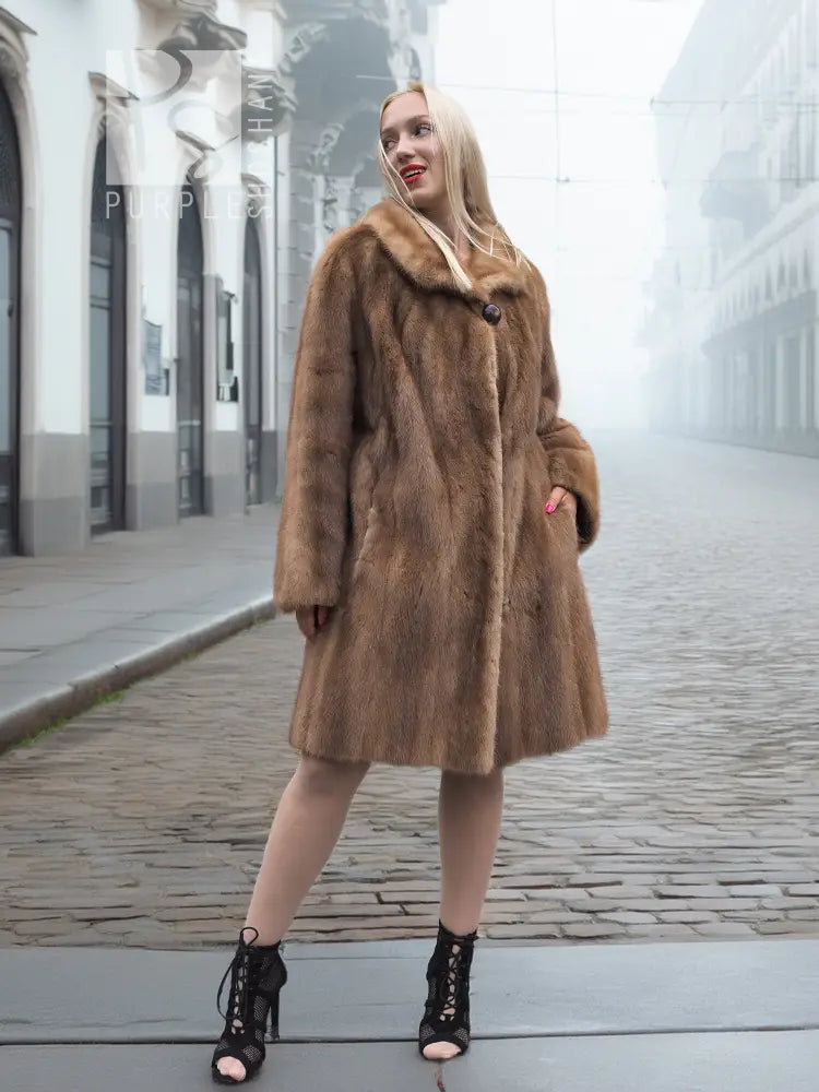 Brown mink fur coat with hood and button front, knee-length hemline
