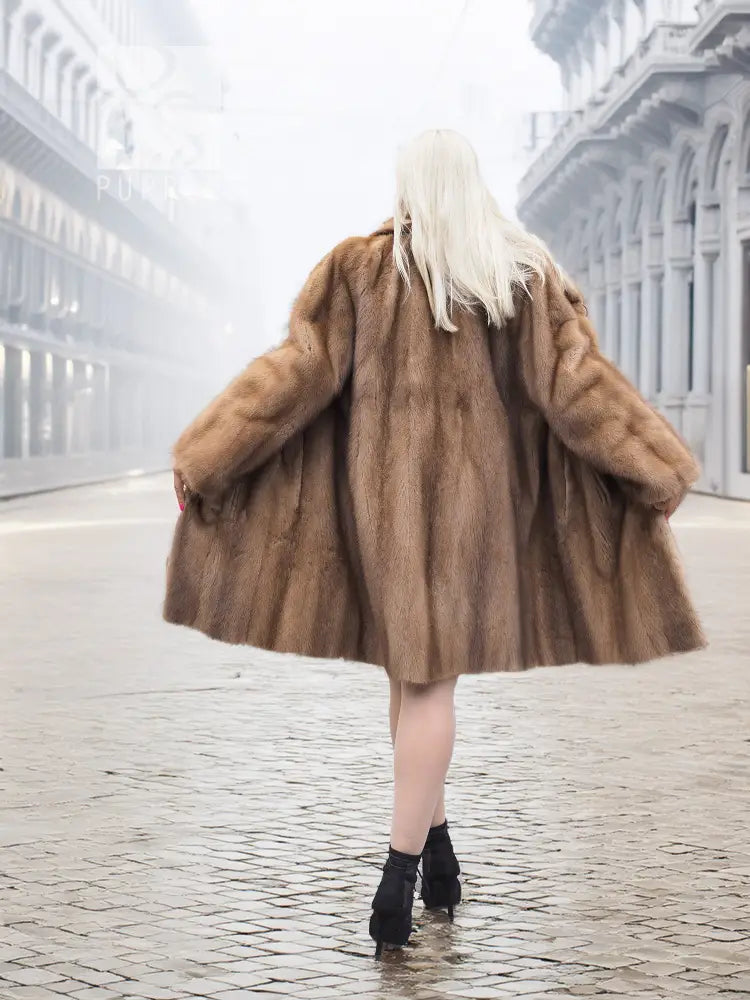 Pastel brown mink fur coat with hood, flared skirt, elbow-to-mid thigh length