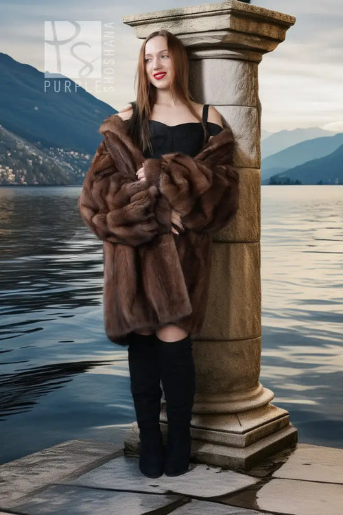 Brown mink fur jacket with oversized plush fur collar and long straight silhouette