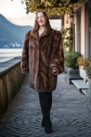 Brown mink fur jacket with plush fur texture and notch collar, walking forward