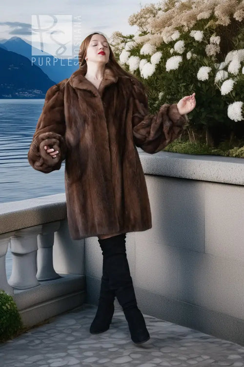 Brown mink fur jacket with long sleeves and full silhouette, standing pose