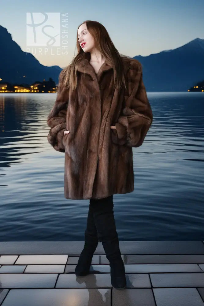 Brown mink fur jacket with full front, fluffy collar, and roomy sleeves