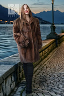 Brown mink fur jacket with textured fur, stand collar, and relaxed shoulders
