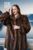 Brown mink fur jacket with plush turn-back collar and textured fur panels