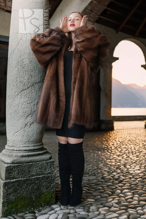 Brown mink fur jacket with thick fur collar and voluminous sleeves