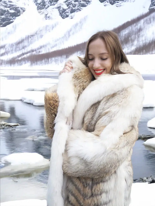 White fur coat with shawl collar and brown fox trim, full-length outerwear