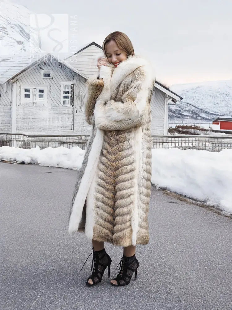 Long coyote fur coat with white fox shawl collar and open front, full-length sleeves