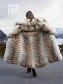 Back view of coyote fur coat with white fox trim and shawl collar, long flared hem
