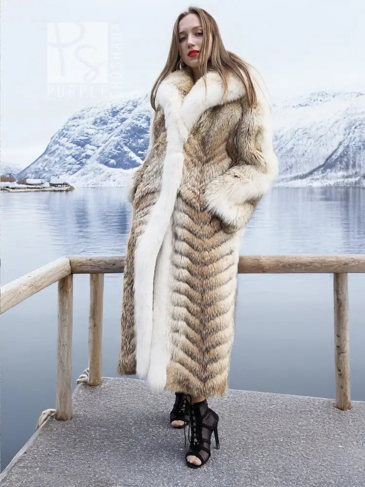 Long fur coat with white fox border, shawl collar, and zigzag patterning on body