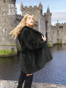 Dark green beaver jacket side view with oversized collar and relaxed shoulder fit
