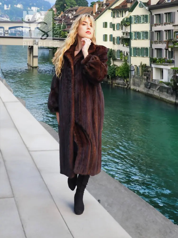 Dark brown mink fur coat with stand collar and long sleeves, mid-calf length
