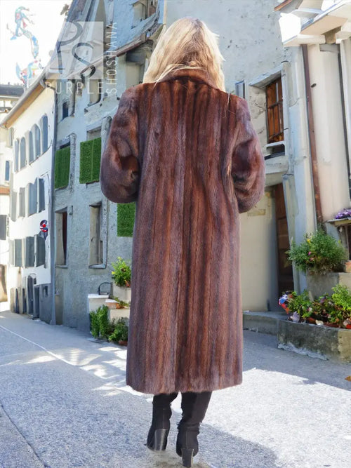 Dark brown mink fur coat back view with long sleeves and relaxed fit