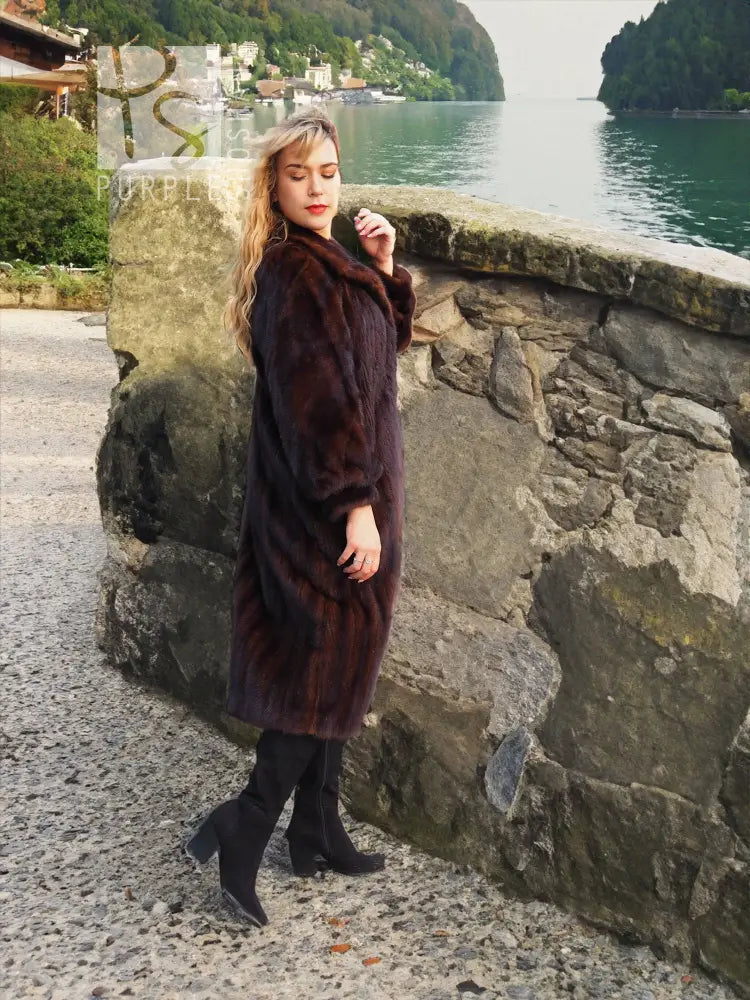 Mahogany-brown mink fur coat with high collar, straight hem, and long sleeves.