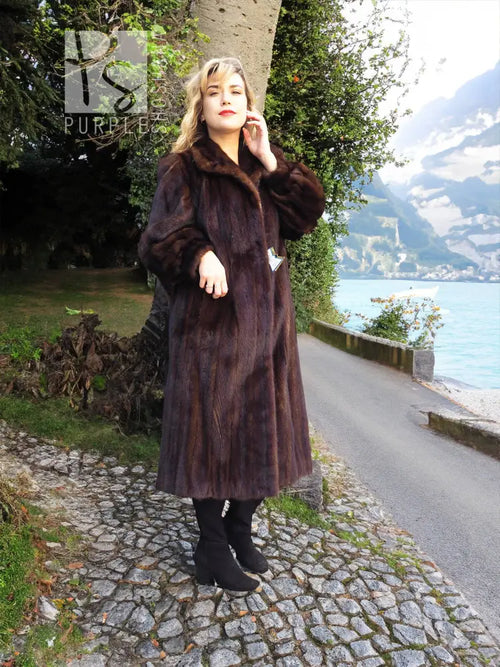 Dark brown mink fur coat with stand collar and long, straight silhouette