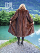 Dark brown mink fur coat back view with wide sleeves and mid-calf length