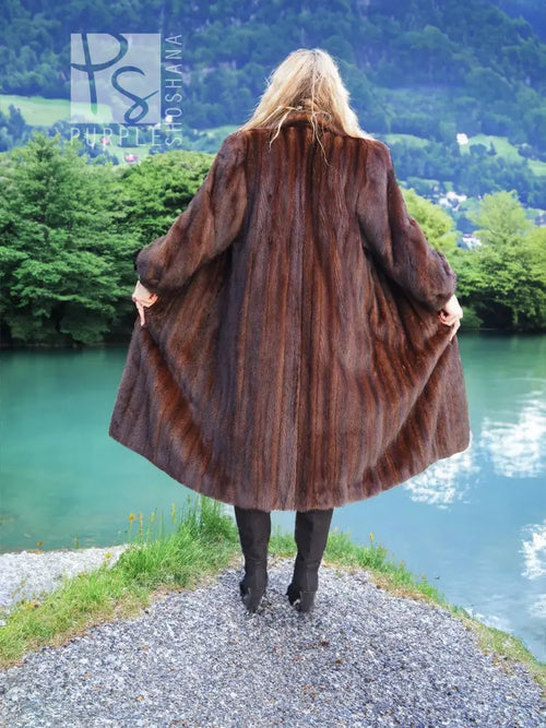 Dark brown mink fur coat back view with wide sleeves and mid-calf length