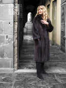 Dark mink fur coat with notched collar, button-front placket, long sleeves, knee length