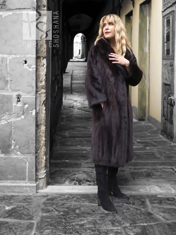 Dark mink fur coat with notched collar, button-front placket, long sleeves, knee length