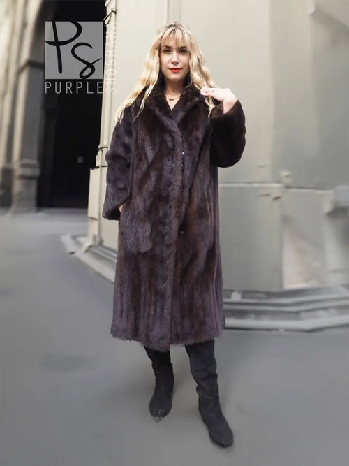 Mink fur coat with notched collar and button front, long sleeves and knee-length cut.